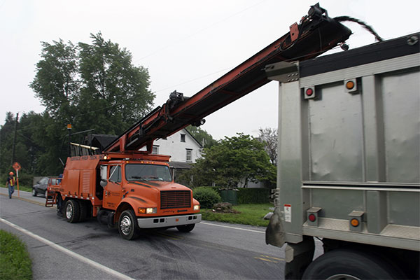 loading a dump truck with debris