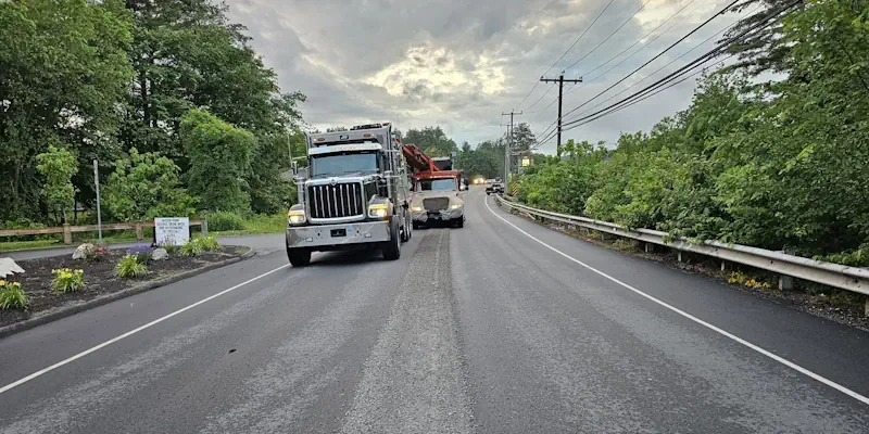 rumble strip cutting crew driving together in their vehicles